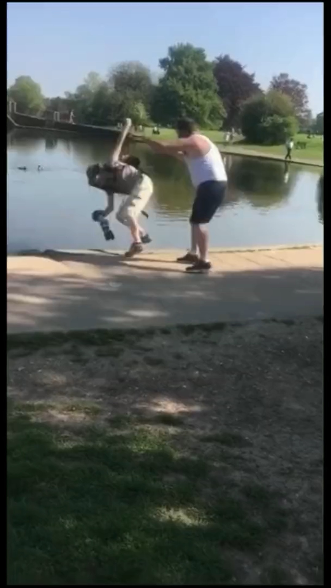 #Drunk guy pushes woman into a pond destroying her expensive camera😡😡