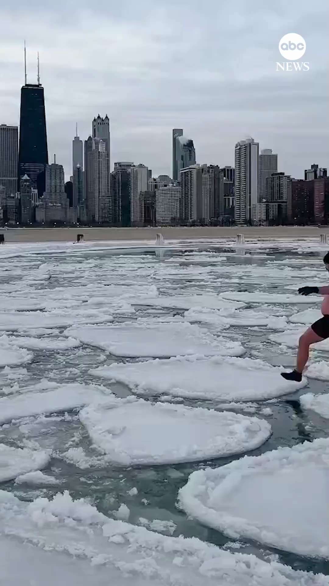 A Chicago man — dressed in his swim trunks — braved the sub-zero wind chill to take a leisurely stro...