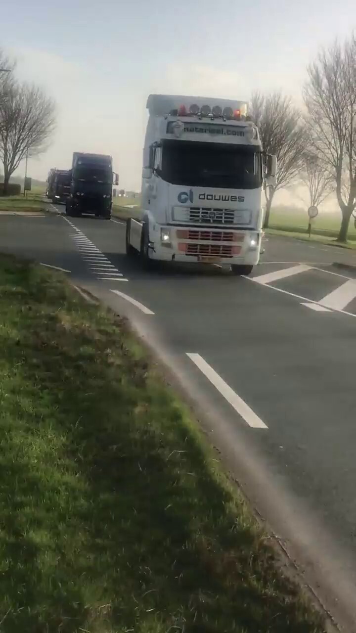 NEW - Dutch truckers drive in a convoy through Friesland, Netherlands, inspired by events in Canada.