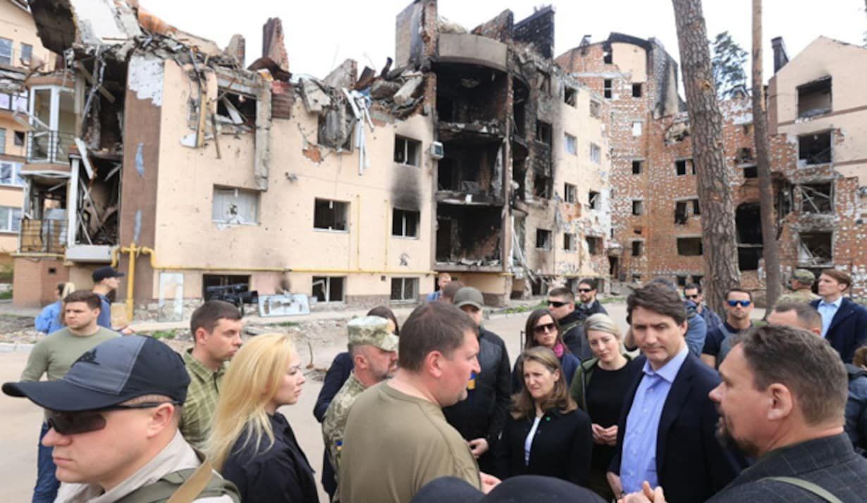 Trudeau wears  a mask in Canada with a 90% jab rate, for show.

But in Ukraine with 35% jab rate, he...