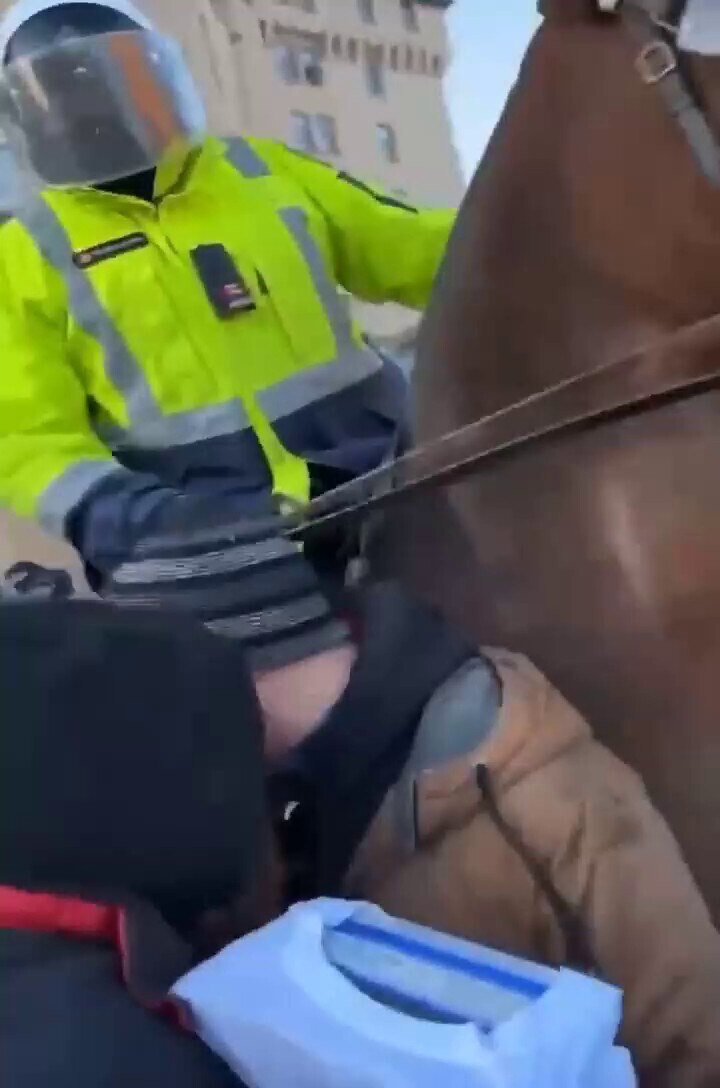 Police violence with horses in Ottawa.