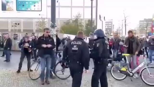 Young girl takes on German police officers who are hassling anti Coronavirus tyranny protesters and ...