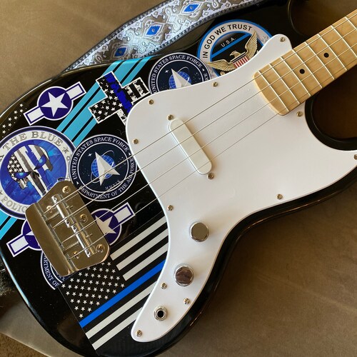 68 Guns is one of my favorite songs, by The Alarm. Photo is my pro cop bass.