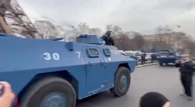 Huge deployment of police in front of the Eiffel Tower. 