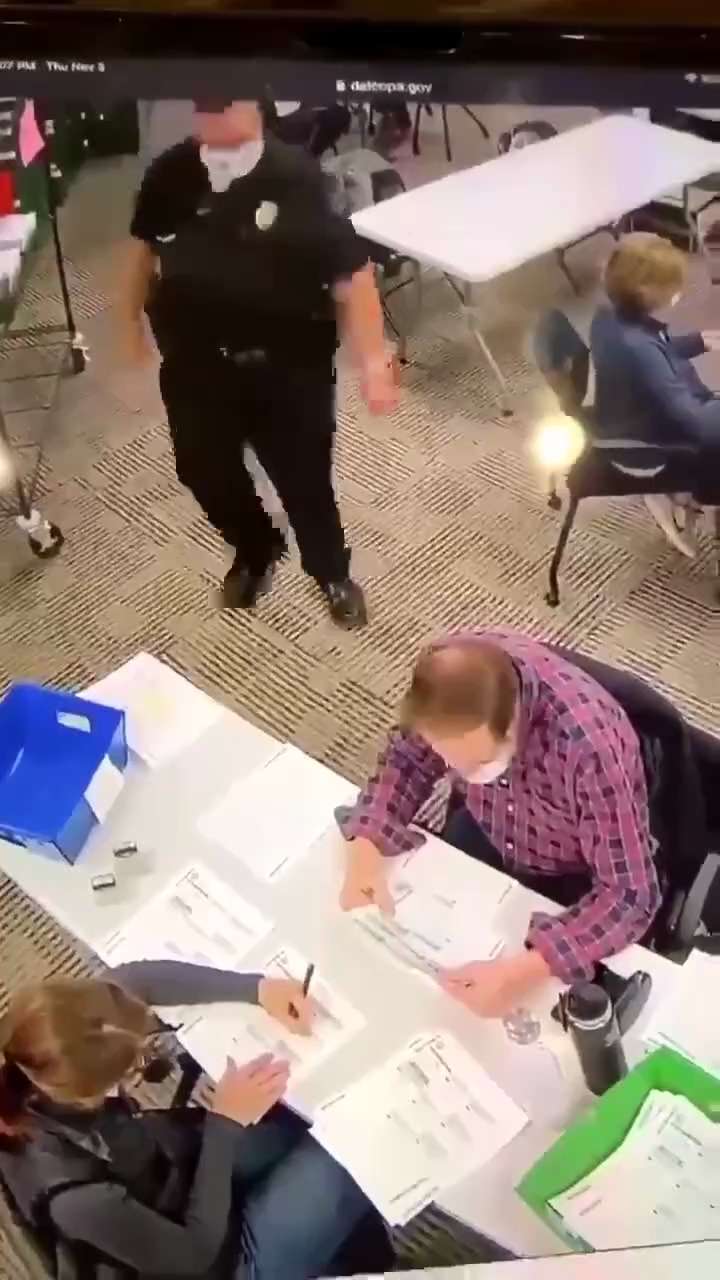 Delaware County, Pennsylvania.  Camera 7. Woman filling out blank ballots and stamping them.  With a...