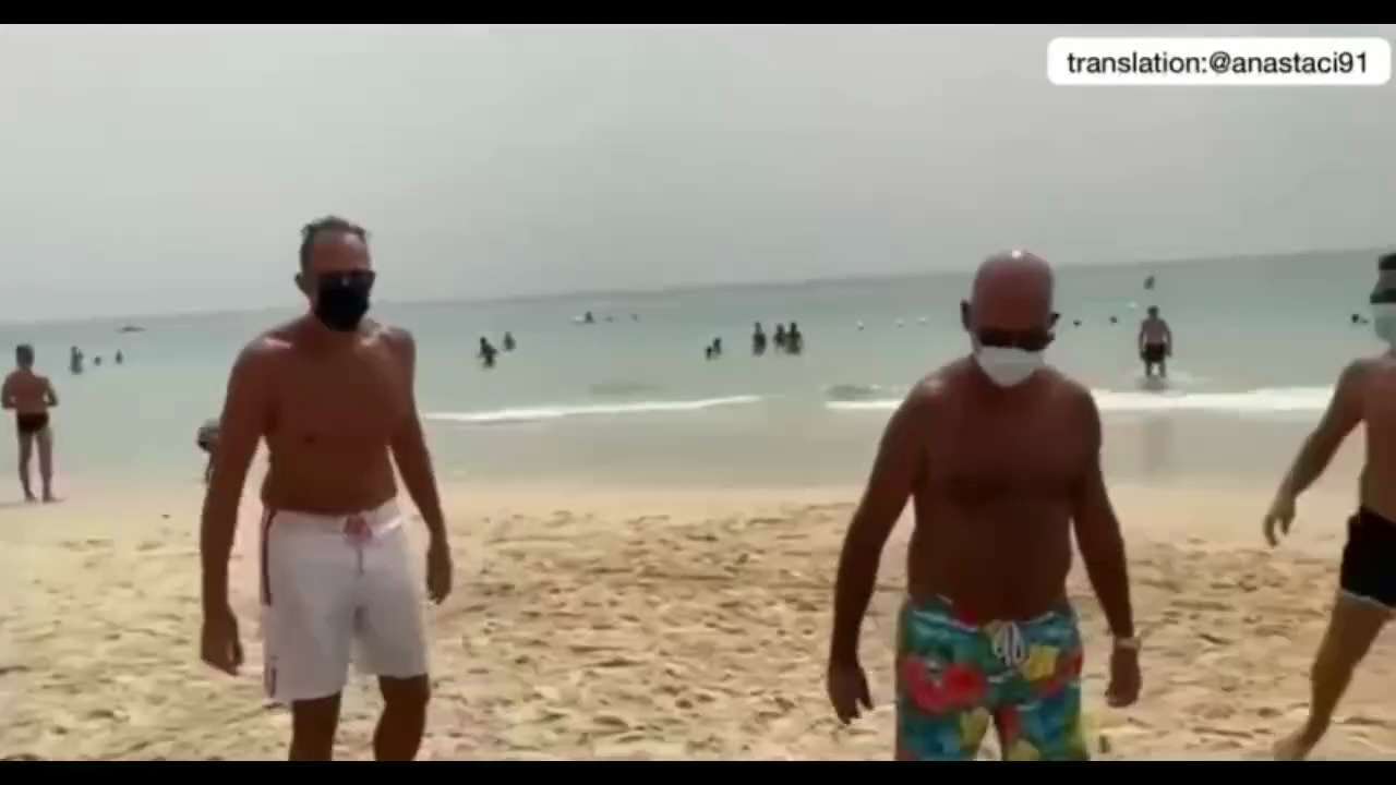 Meanwhile in Italy they are playing football in masks on the beach