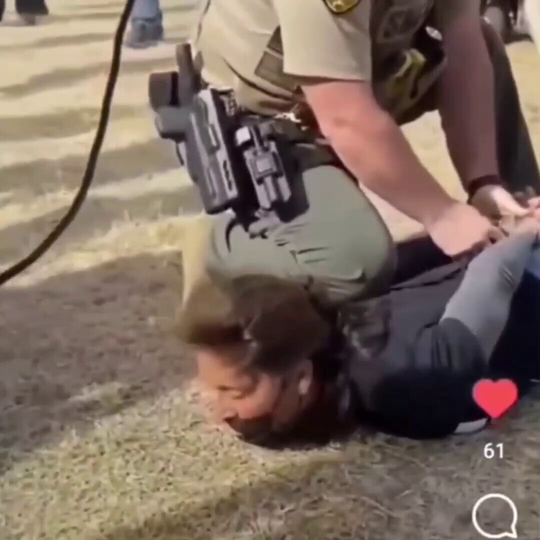 Biden supporter being arrested at Trump rally for stealing. Imagine still wearing a Biden shirt?? Co...