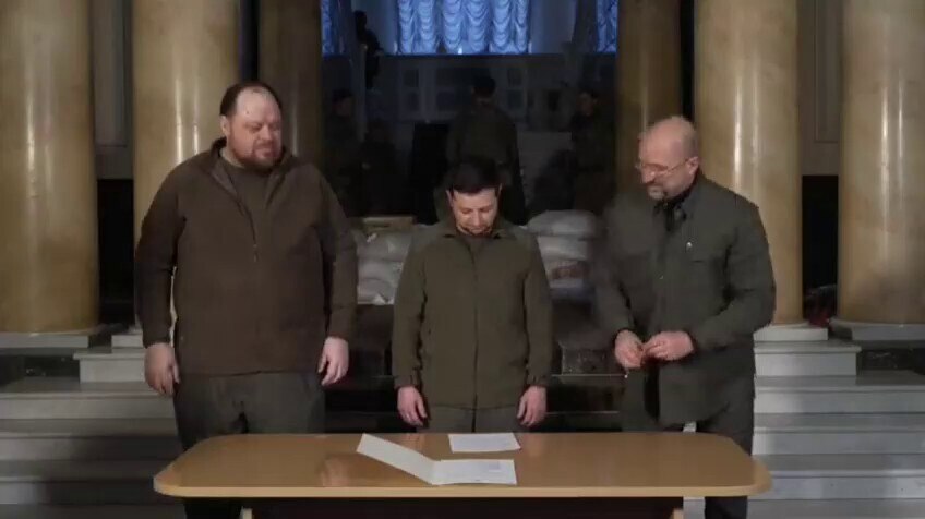 Ukraine's president Zelensky signs a fast-track EU membership application in military wear and with ...