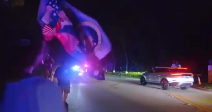 🇺🇸 — NOW: Live View of Mar-a-Lago as Trump supporters gather outside after 30 FBI agents raided Pr...