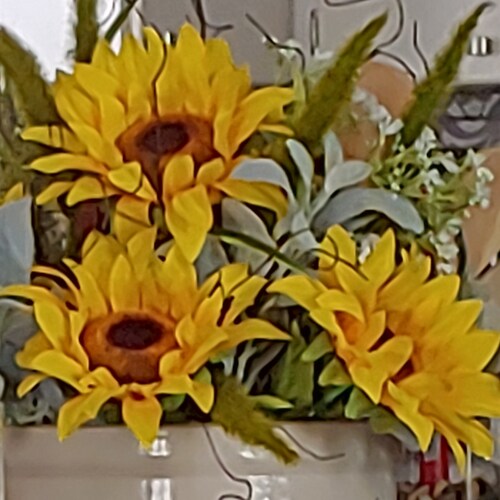 I am a floral designer and loving it! Creating is my happy place along with sewing, floating in the pool on a hot day and time with my family.