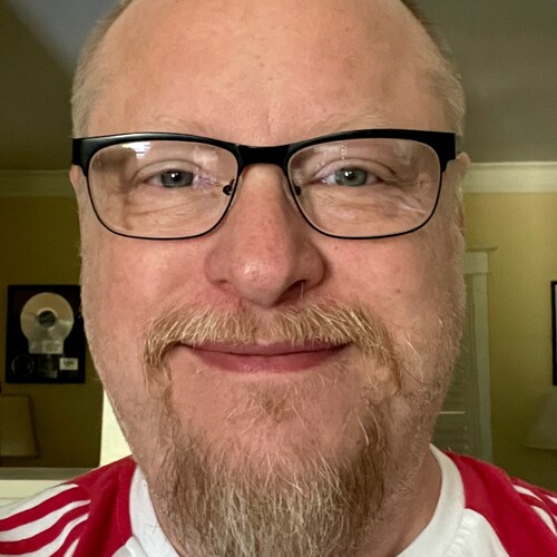 American.  Arkansas Razorback fan. proud cat dad.
