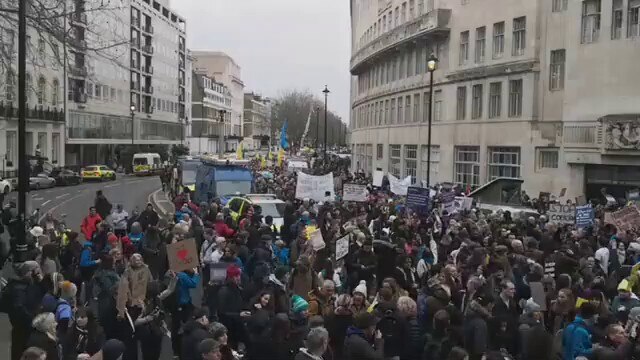 Protesters against covid passports and mandates gathering outside the BBC in central London.