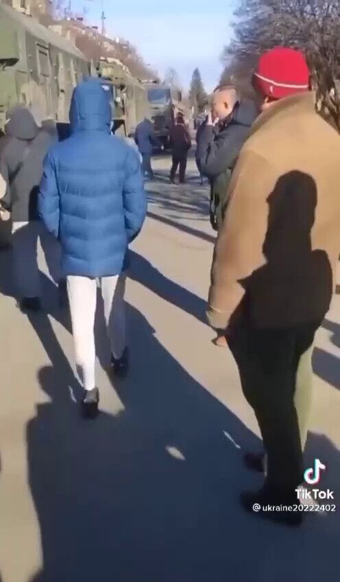 Ukrainians stand Infront of a convoy of Russian army vehicles, they could easily drive over them, no...
