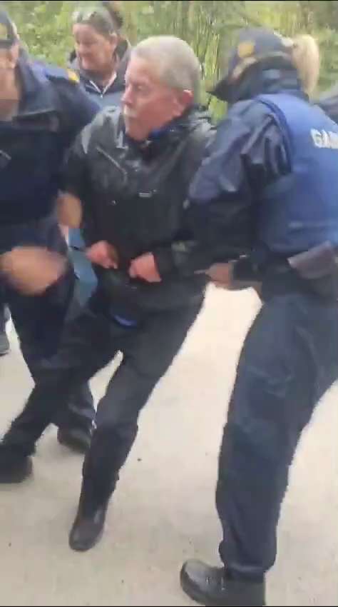Gardaí now in balaclavas in Newton Mount Kennedy in Ireland dragging away locals who are opposing th...