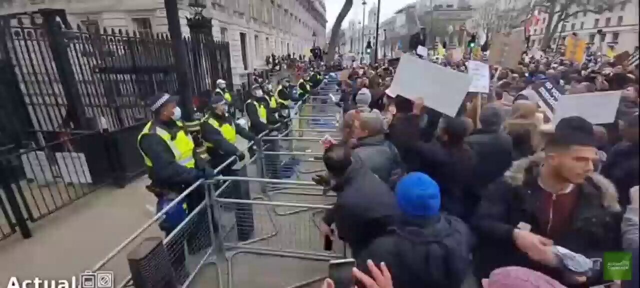 NHS staff that will be sacked for not allowing themselves to be injected with the experimental covid jab launch their uniforms at downing Street.