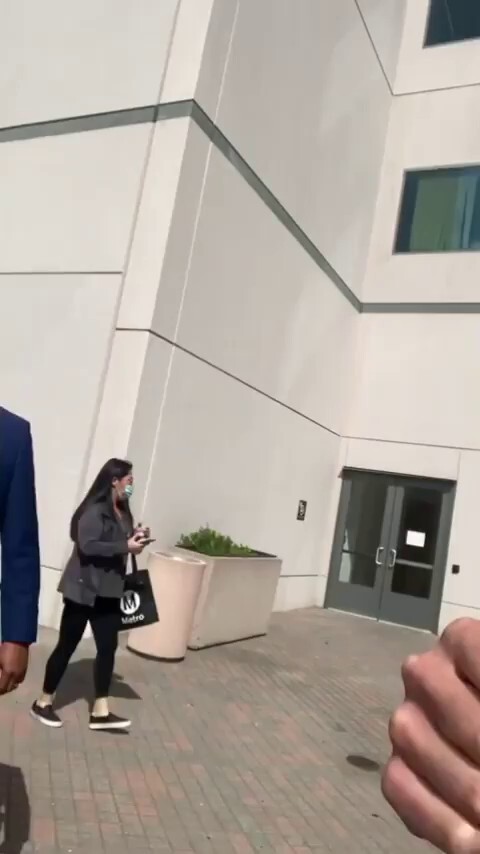 Dr Rake being escorted out of LA hospital 