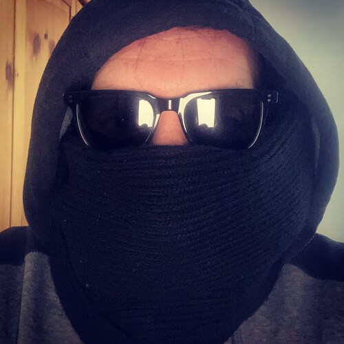 Musician. Likes to wear dark colours. Shady but not too shady.