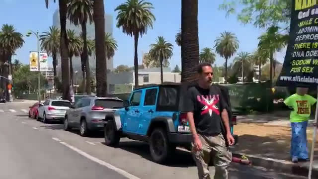 Antifa attack a group of street preachers in Los Angeles. One of the antifa smashes a skateboard on ...