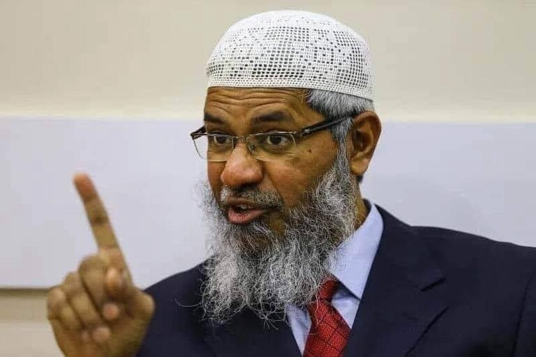 Islamic preacher Zakir Naik got into a taxi in London and said aloud to the taxi driver:
Brother please turn off the radio because as the Holy Qur'an comma