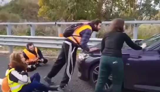😂👍 This driver wanted to get to his wife so he crushed the climate activists blocking the road.

W...