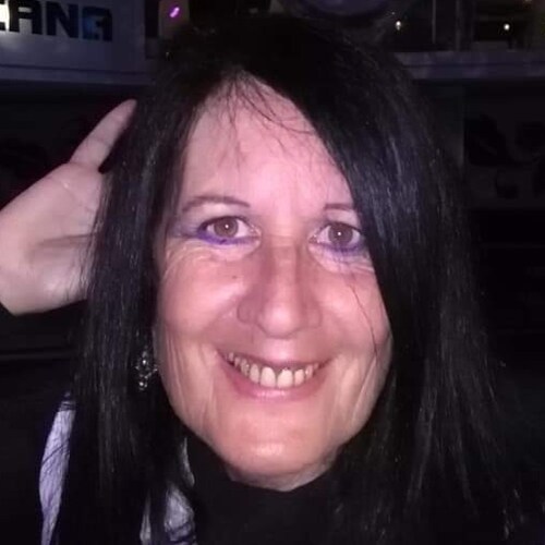 It's the uniform. Dictators always wear one. 