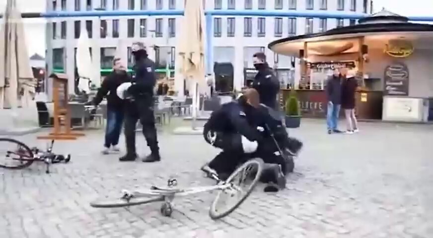 GERMAN CITIZEN READS CONSTITUTION IN PUBLIC SQUARE COPS SHOW UP AND BEAT HIM UP