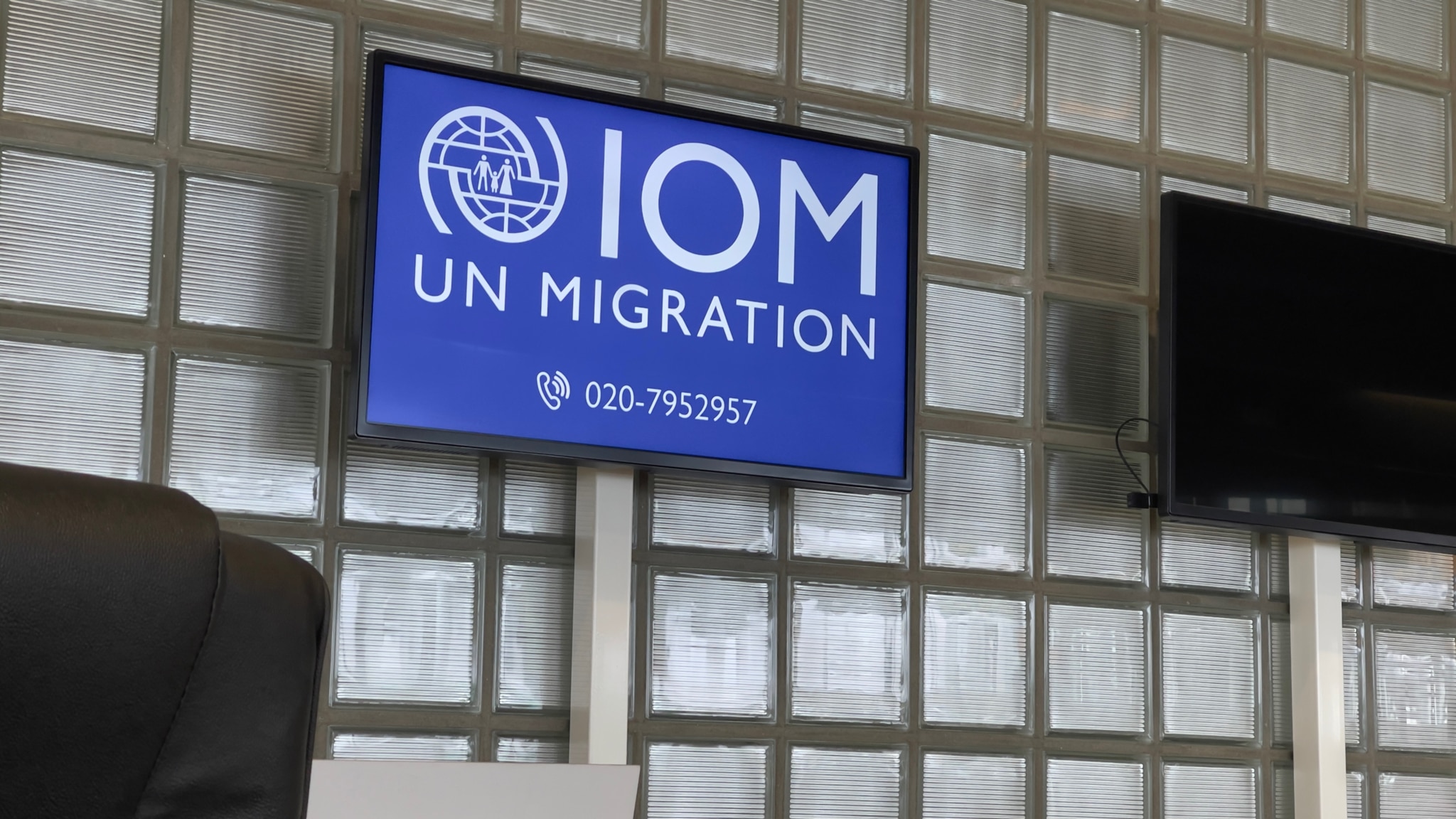 Amsterdam— IOM facilitation at Schipol Airport in Amsterdam.  These are the same evil people encouraging invasion of United States and mass death in Darien Gap.  True evil has an office and ticket counter at the airport!  I just made three images minutes ago.