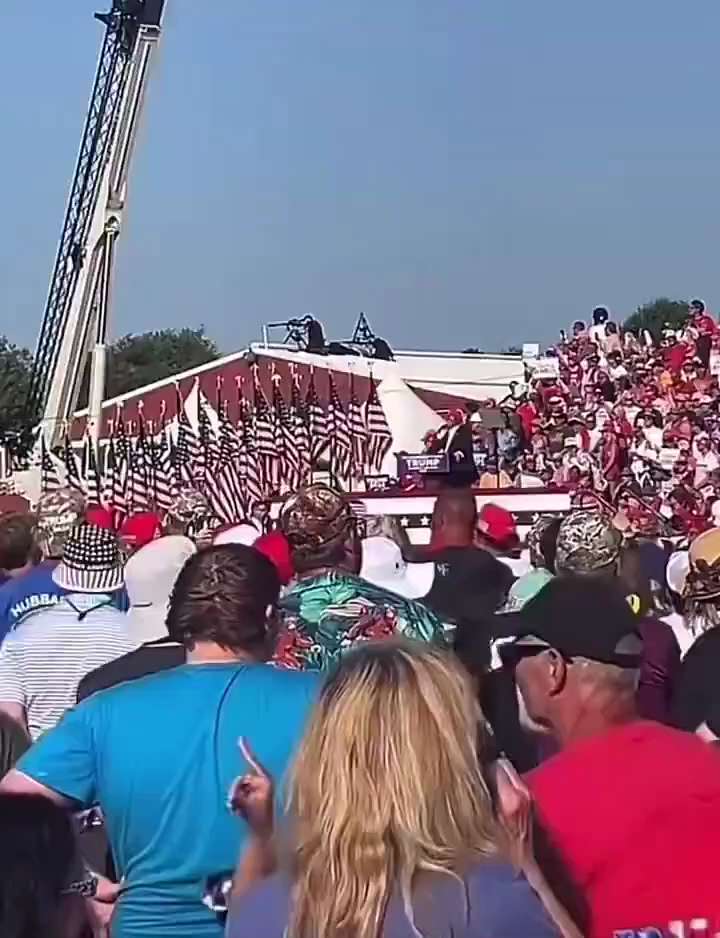 Footage of a law enforcement sniper tracking what appears to be the shooter. It looks like the snipe...