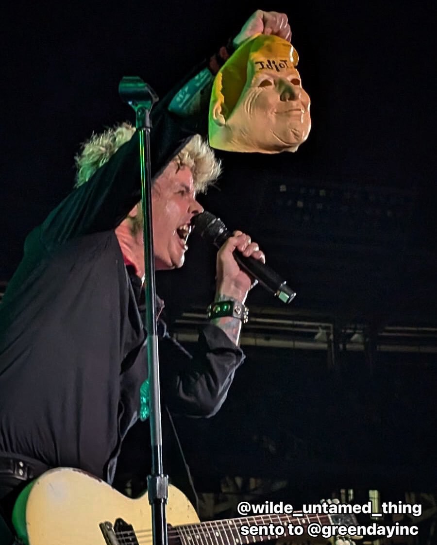 Billie Joe Armstrong holds up a Donald Trump head at a Green Day concert in DC just 2 weeks after Do...