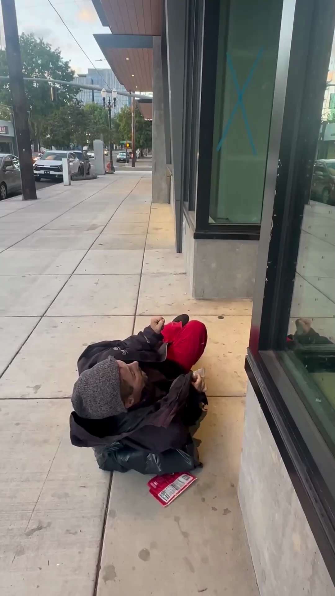 A dead body frozen in a horrific pose on the streets of Portland, still clutching the remnants of th...
