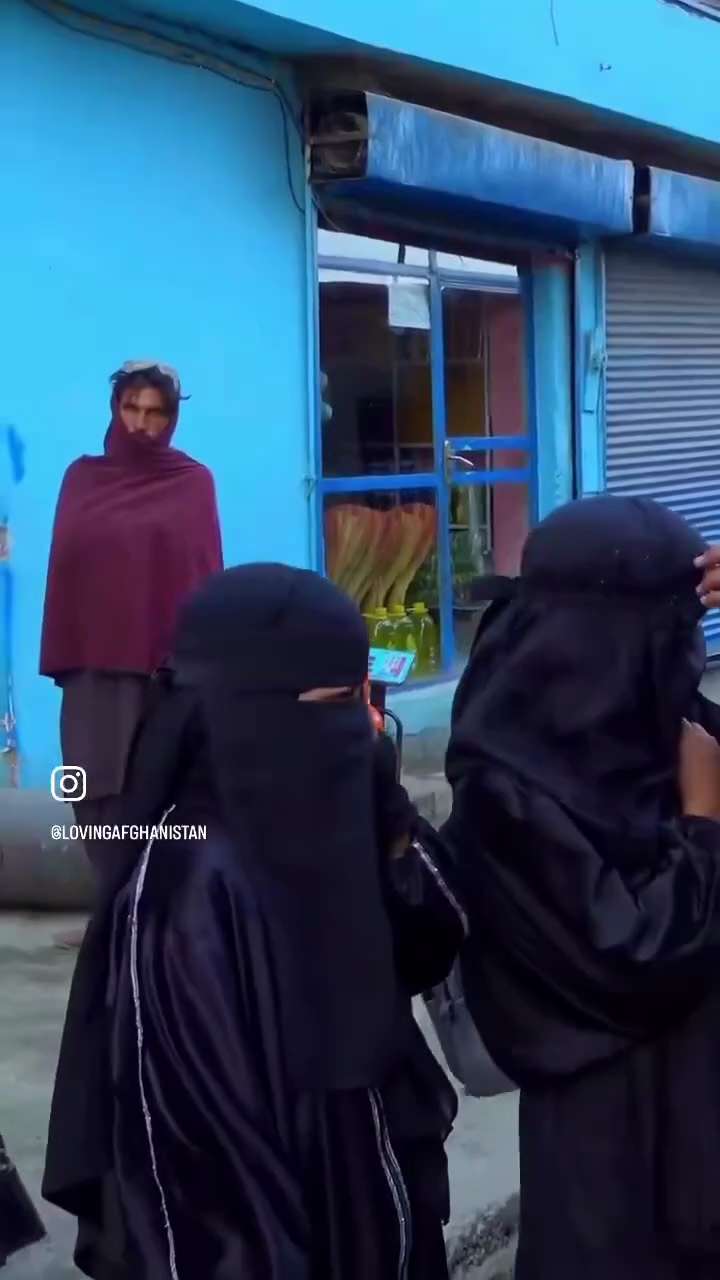 A young Afghan girl cries behind a compulsory veil as she tells a reporter: “I pray that the schools...