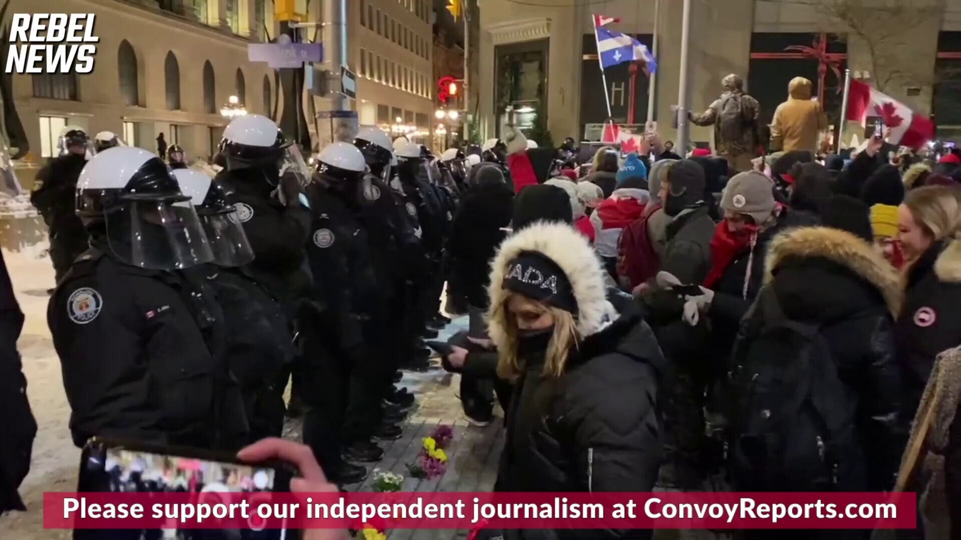 Protesters have put flowers at the  police line in Ottawa.

 http://ConvoyReports.com for more.