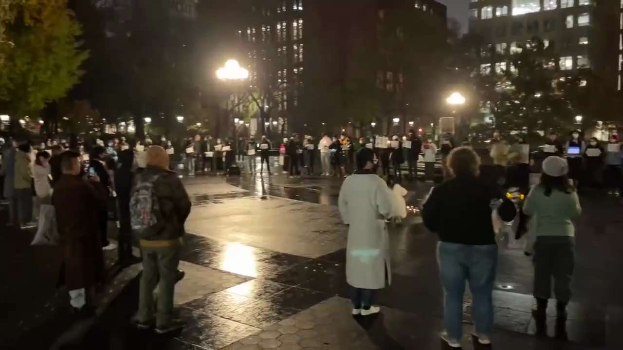 Protest in Washington Square Park & NYU. People held white papers and played anthems in support of t...